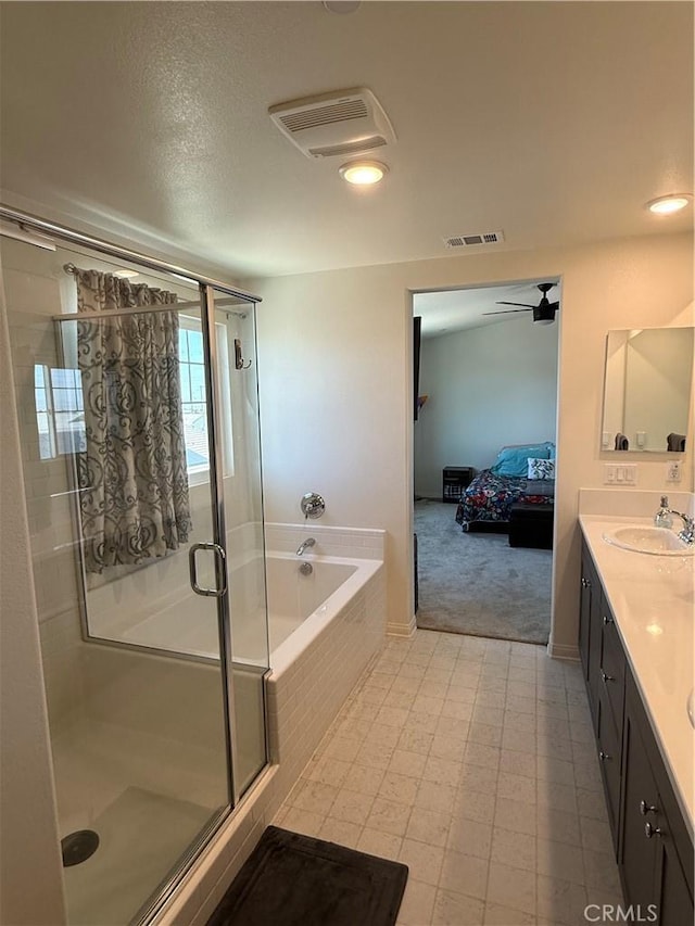 12708 Ojo Caliente St, Victorville, CA 92392 - bathroom with a bath, a shower stall, double vanity, ensuite bath, and tile patterned floors