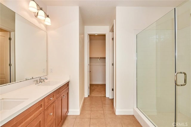 245 Snapdragon Ln, Glendora, CA 91741 - bathroom with a stall shower, tile patterned flooring, double vanity, and a spacious closet
