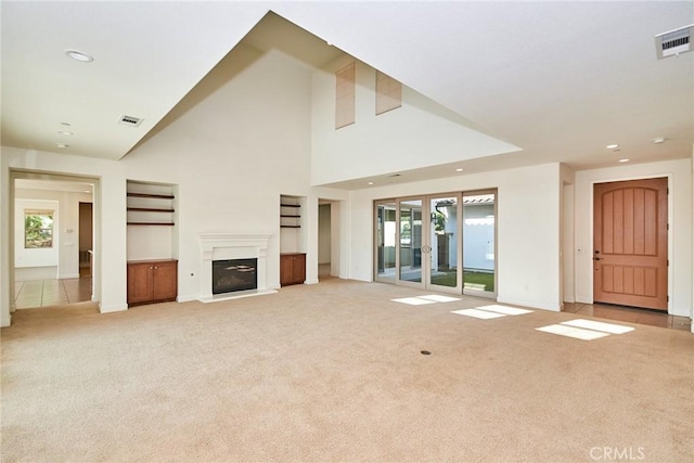 245 Snapdragon Ln, Glendora, CA 91741 - unfurnished living room with light carpet, a glass covered fireplace, recessed lighting, healthy amount of natural light, and a high ceiling