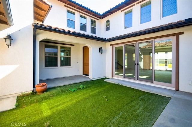 245 Snapdragon Ln, Glendora, CA 91741 - back of house with a tile roof, stucco siding, and a lawn