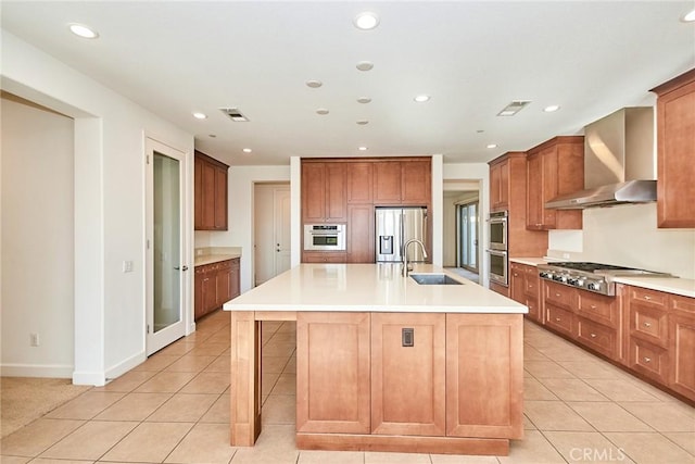245 Snapdragon Ln, Glendora, CA 91741 - kitchen featuring wall chimney range hood, appliances with stainless steel finishes, light tile patterned floors, recessed lighting, and light countertops