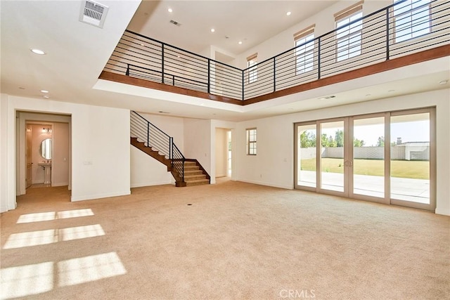 245 Snapdragon Ln, Glendora, CA 91741 - unfurnished living room with carpet flooring, stairs, recessed lighting, plenty of natural light, and french doors