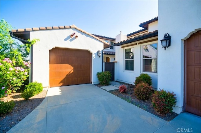 245 Snapdragon Ln, Glendora, CA 91741 - view of front facade with stucco siding, concrete driveway, an attached garage, and a tiled roof