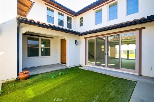 245 Snapdragon Ln, Glendora, CA 91741 - back of house featuring a tiled roof, stucco siding, and a yard
