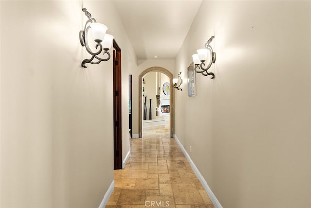 43650 La Cruz Dr, Temecula, CA 92590 - hall with stone tile floors and arched walkways