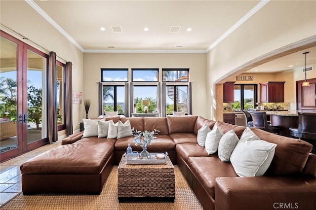 43650 La Cruz Dr, Temecula, CA 92590 - living room featuring arched walkways, french doors, recessed lighting, and crown molding