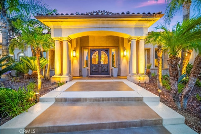 43650 La Cruz Dr, Temecula, CA 92590 - exterior entry at dusk with a porch and stucco siding