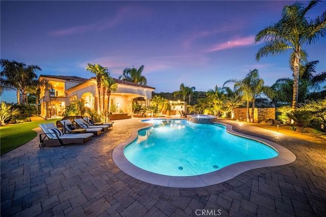 43650 La Cruz Dr, Temecula, CA 92590 - pool at dusk with a patio area and a pool with connected hot tub