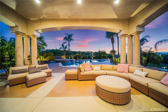 43650 La Cruz Dr, Temecula, CA 92590 - patio terrace at dusk featuring outdoor lounge area, a patio area, and a pool with connected hot tub