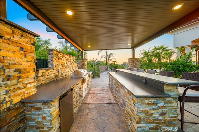 43650 La Cruz Dr, Temecula, CA 92590 - patio terrace at dusk with exterior kitchen
