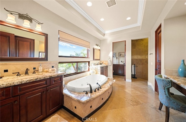 43650 La Cruz Dr, Temecula, CA 92590 - full bath featuring two vanities, a jetted tub, crown molding, recessed lighting, and a raised ceiling