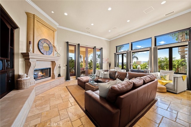 43650 La Cruz Dr, Temecula, CA 92590 - living area featuring stone tile floors, recessed lighting, ornamental molding, and a premium fireplace