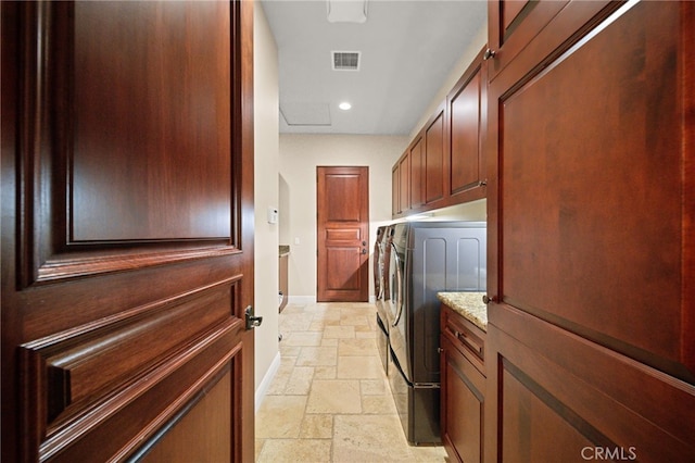 43650 La Cruz Dr, Temecula, CA 92590 - washroom with stone tile floors, independent washer and dryer, cabinet space, and recessed lighting
