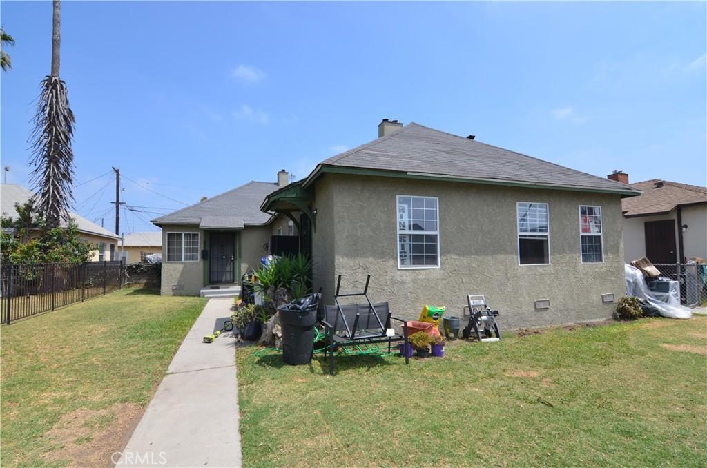 533 W Almond St, Compton, CA 90220 - back of property featuring stucco siding and a shingled roof