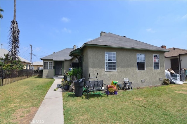 533 W Almond St, Compton, CA 90220 - back of property featuring stucco siding and a shingled roof