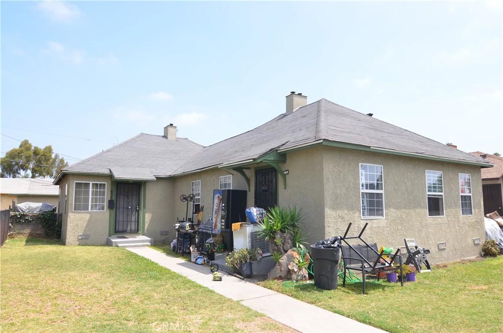 533 W Almond St, Compton, CA 90220 - back of property featuring stucco siding and a chimney