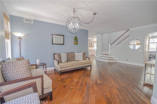 25531 Durant Pl, Stevenson Ranch, CA 91381 - living room featuring stairs, a chandelier, wood finished floors, and ornamental molding
