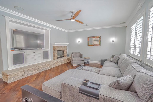 25531 Durant Pl, Stevenson Ranch, CA 91381 - living room featuring a ceiling fan, wood finished floors, crown molding, and a stone fireplace