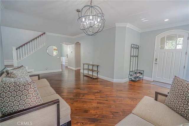 25531 Durant Pl, Stevenson Ranch, CA 91381 - living area featuring arched walkways, wood-type flooring, stairway, a chandelier, and ornamental molding
