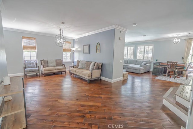 25531 Durant Pl, Stevenson Ranch, CA 91381 - living area featuring a chandelier, healthy amount of natural light, dark wood-style flooring, and ornamental molding