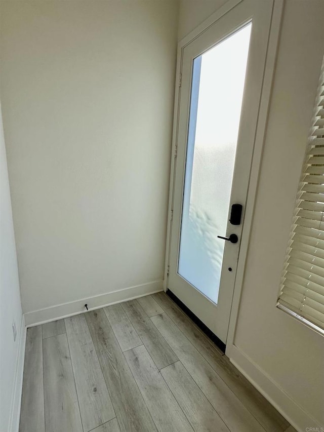 2170 Birch Rd Unit 111, Chula Vista, CA 91915 - doorway to outside with light wood finished floors and baseboards