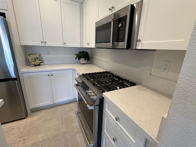 2170 Birch Rd Unit 111, Chula Vista, CA 91915 - kitchen featuring stainless steel appliances, white cabinets, and light tile patterned floors