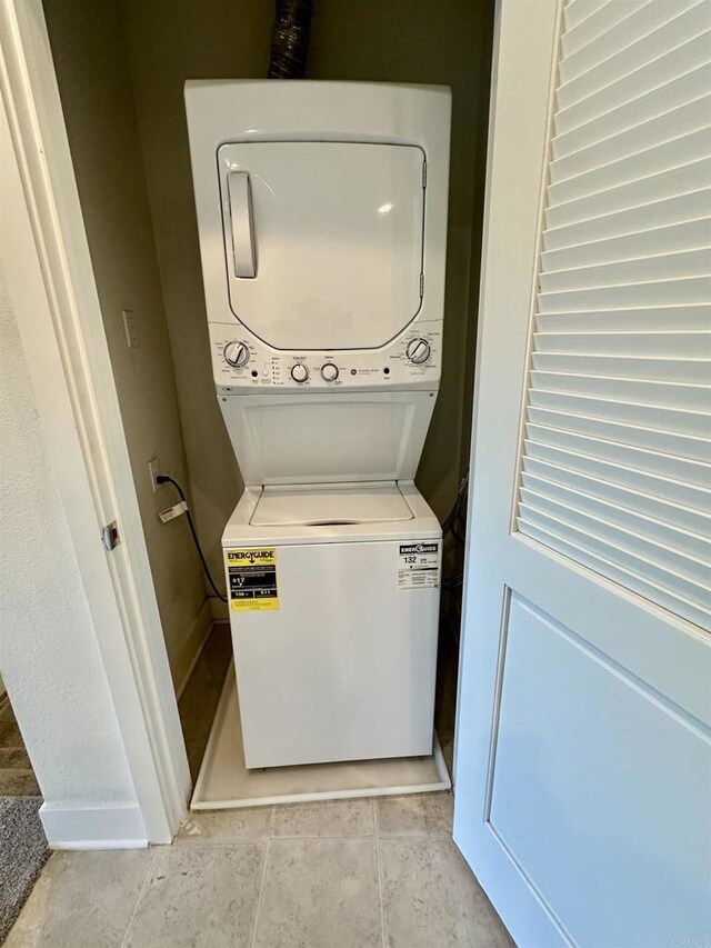 2170 Birch Rd Unit 111, Chula Vista, CA 91915 - laundry area featuring estacked washer and dryer and light tile patterned floors