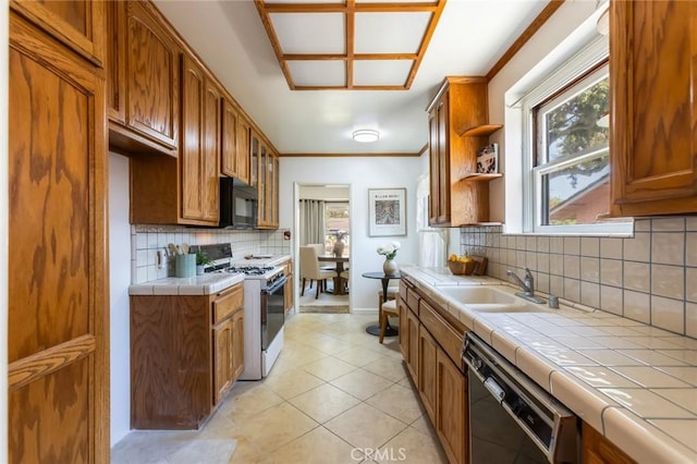 1137 Lafayette St, San Gabriel, CA 91776 - kitchen with black appliances, tile counters, brown cabinetry, and ornamental molding