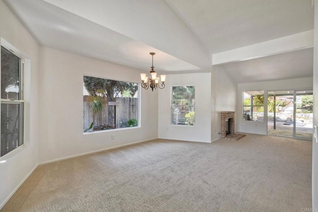 5261 Hubbert St, Oceanside, CA 92056 - unfurnished living room with carpet, lofted ceiling, a chandelier, and a brick fireplace