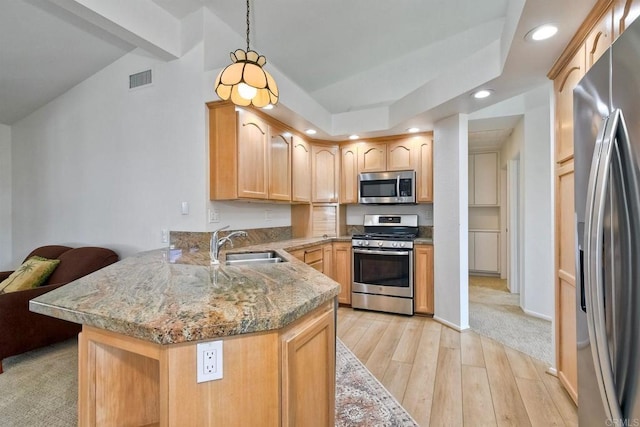 5261 Hubbert St, Oceanside, CA 92056 - kitchen featuring appliances with stainless steel finishes, a peninsula, recessed lighting, light wood-type flooring, and vaulted ceiling