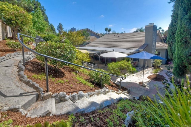5261 Hubbert St, Oceanside, CA 92056 - rear view of house featuring a patio, a chimney, and a tile roof