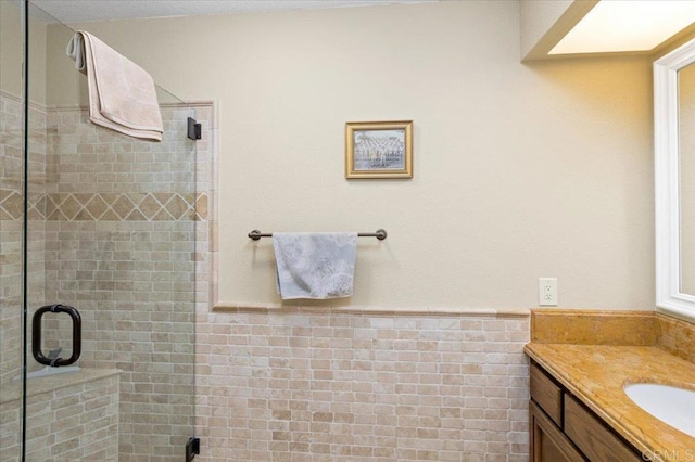 4635 Allende Ave, Oceanside, CA 92057 - full bathroom with vanity, a shower stall, and a wainscoted wall