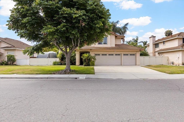 4635 Allende Ave, Oceanside, CA 92057 - view of front of house with a tile roof, driveway, a garage, and stucco siding
