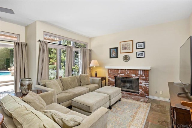 4635 Allende Ave, Oceanside, CA 92057 - living area featuring stone finish flooring and a brick fireplace