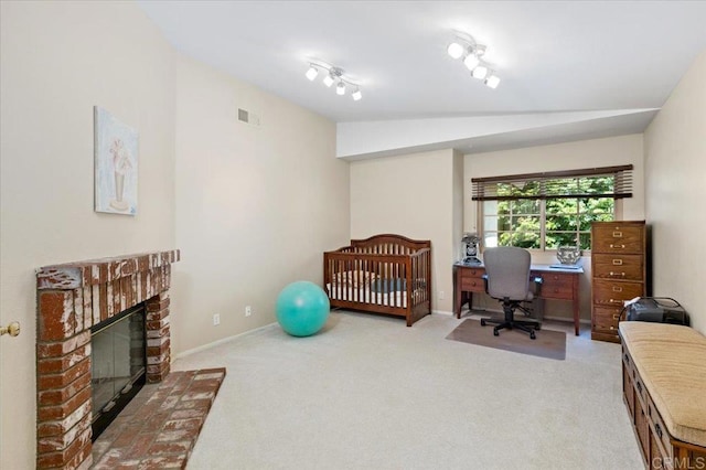 4635 Allende Ave, Oceanside, CA 92057 - bedroom with carpet floors, a desk, a fireplace, and vaulted ceiling