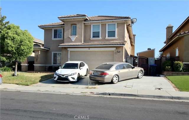 37575 Parkway Dr, Beaumont, CA 92223 - mediterranean / spanish house featuring a tile roof, concrete driveway, stucco siding, and a garage