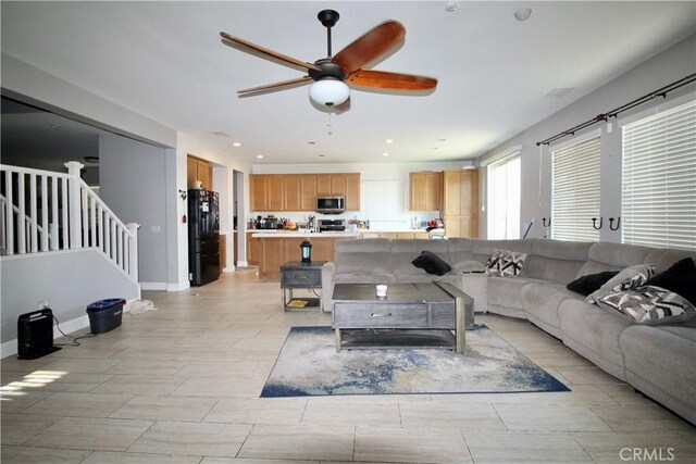 37575 Parkway Dr, Beaumont, CA 92223 - living area with ceiling fan, stairs, and recessed lighting