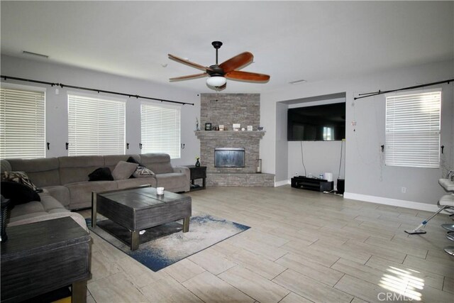 37575 Parkway Dr, Beaumont, CA 92223 - living room with a ceiling fan, wood finished floors, and a fireplace