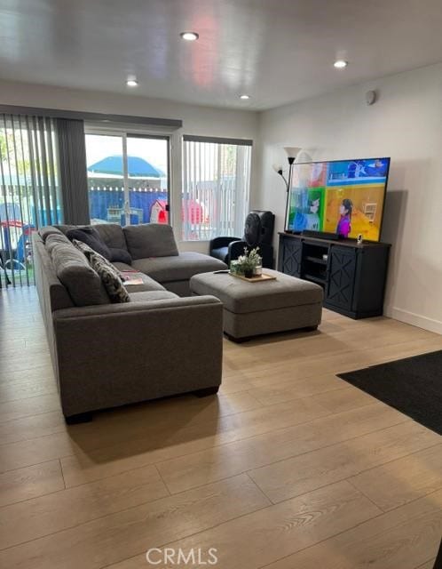 5700 Etiwanda Ave Unit 105, Tarzana, CA 91356 - living area featuring light wood-style floors and recessed lighting