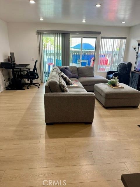 5700 Etiwanda Ave Unit 105, Tarzana, CA 91356 - living room featuring plenty of natural light, recessed lighting, and light wood-type flooring