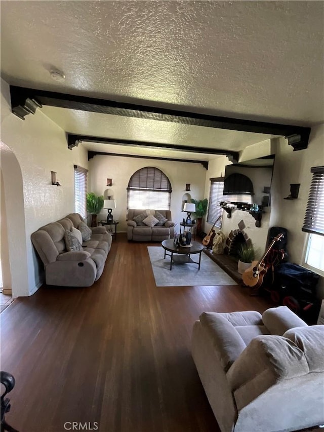 10430 San Jose Ave, South Gate, CA 90280 - living area featuring arched walkways, a textured ceiling, wood finished floors, and beam ceiling