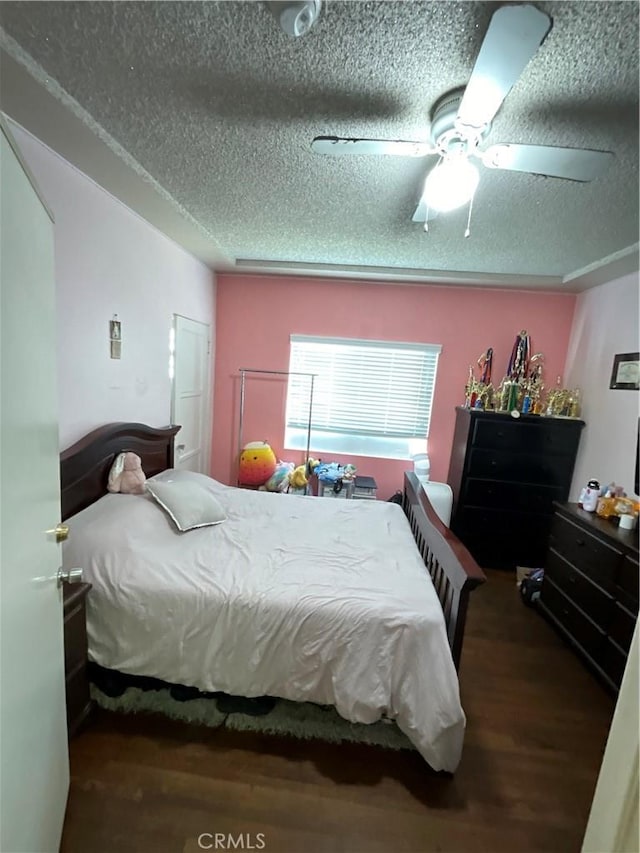 10430 San Jose Ave, South Gate, CA 90280 - bedroom featuring a textured ceiling, wood finished floors, and a ceiling fan