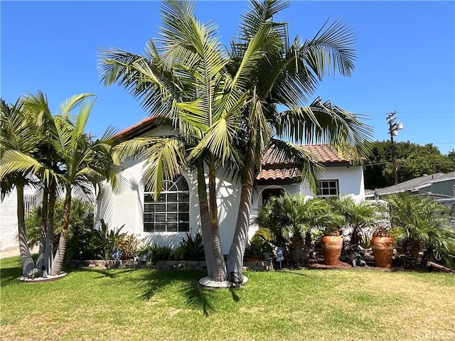 10430 San Jose Ave, South Gate, CA 90280 - view of side of home with a yard and stucco siding