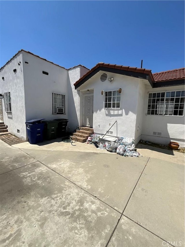 10430 San Jose Ave, South Gate, CA 90280 - back of house with crawl space, stucco siding, and a tiled roof