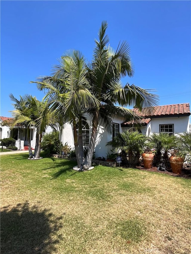 10430 San Jose Ave, South Gate, CA 90280 - view of side of property featuring a yard and stucco siding