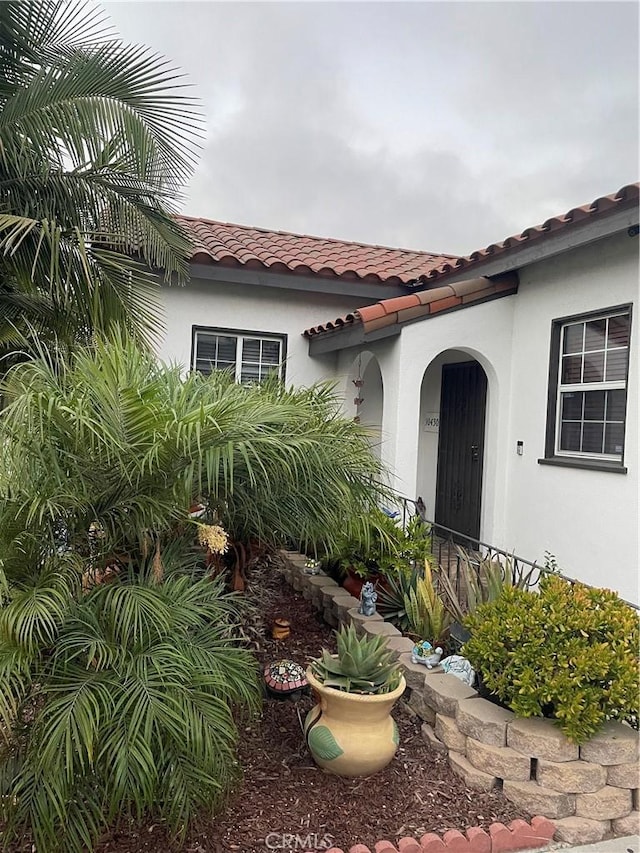 10430 San Jose Ave, South Gate, CA 90280 - entrance to property featuring stucco siding and a tiled roof