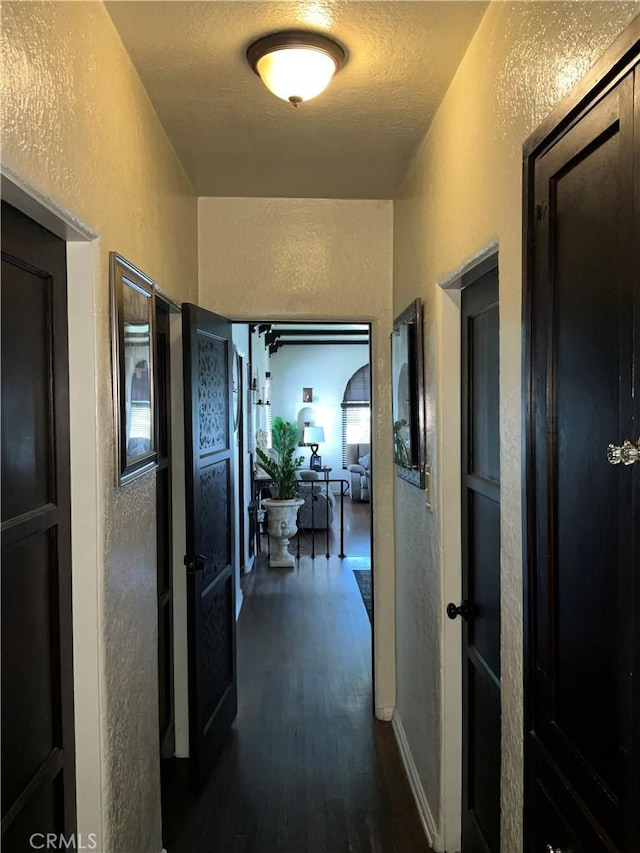 10430 San Jose Ave, South Gate, CA 90280 - hall featuring a textured wall and dark wood finished floors