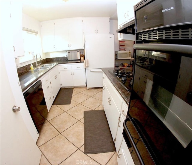 2904 Sterling St, Pomona, CA 91767 - kitchen featuring black appliances, dark countertops, white cabinets, and light tile patterned floors