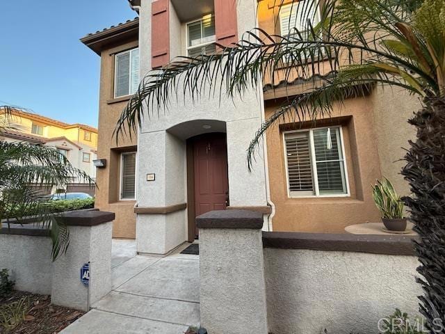 2181 Caminito Norina Unit 134, Chula Vista, CA 91915 - doorway to property featuring stucco siding and a balcony