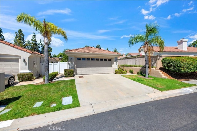40633 Corte Albara, Murrieta, CA 92562 - view of front of home featuring a garage, a tiled roof, and stucco siding